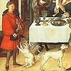 Man in red houp with dogs at feast.  Not directly related to this article, but a neat image.